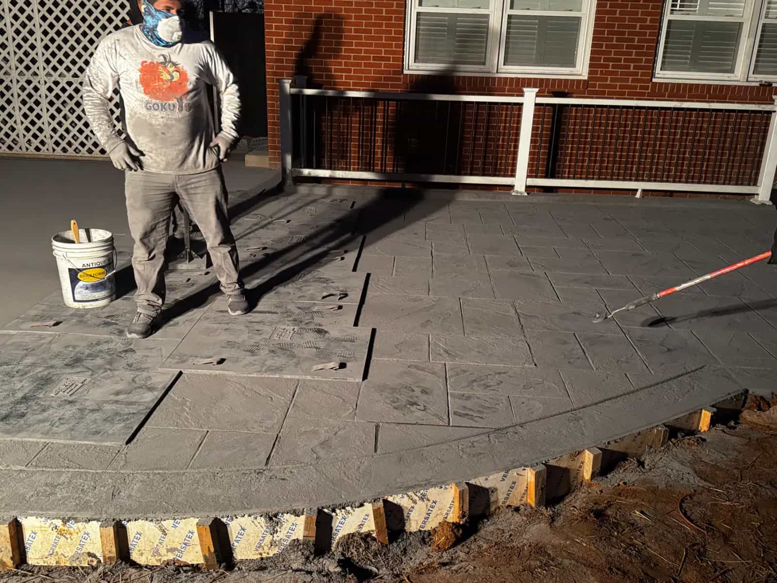 Stamped concrete installation showing decorative pattern work in progress