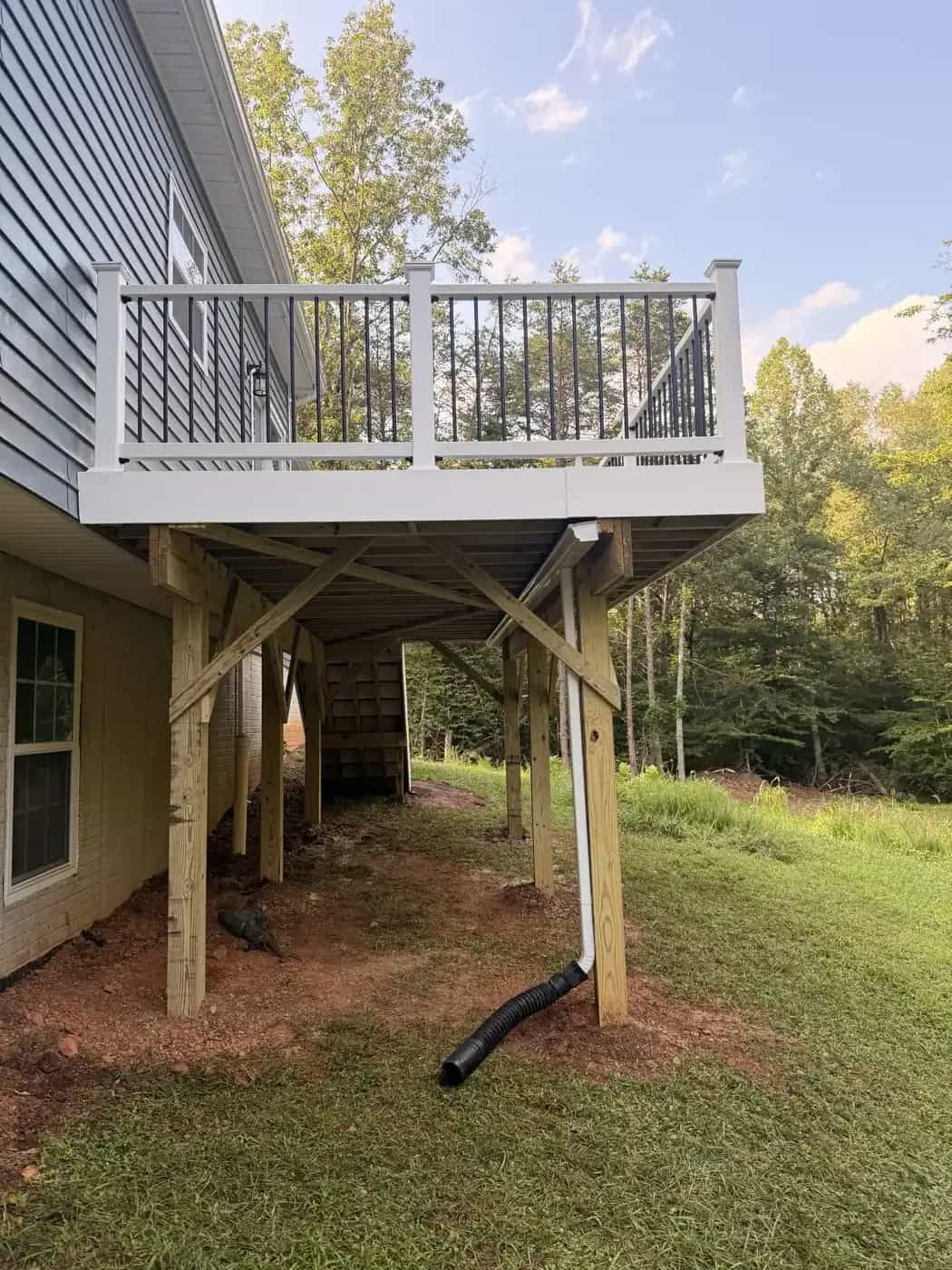 Elevated Trex Pebble Beach deck with RainGuard drain protection for the lower floor below