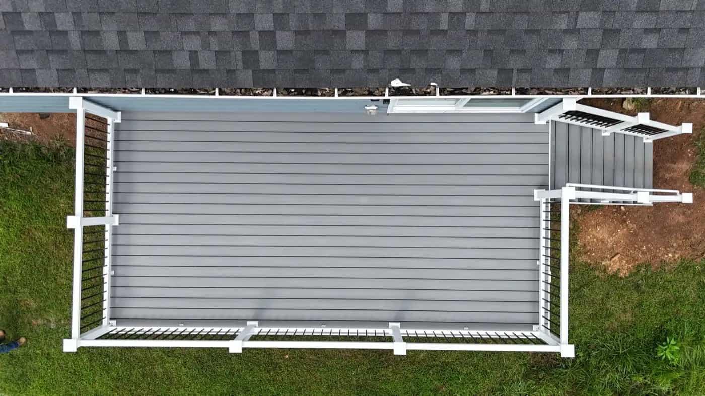 Aerial view of finished 10x20 Trex Pebble Beach deck with white railing in Culpeper VA