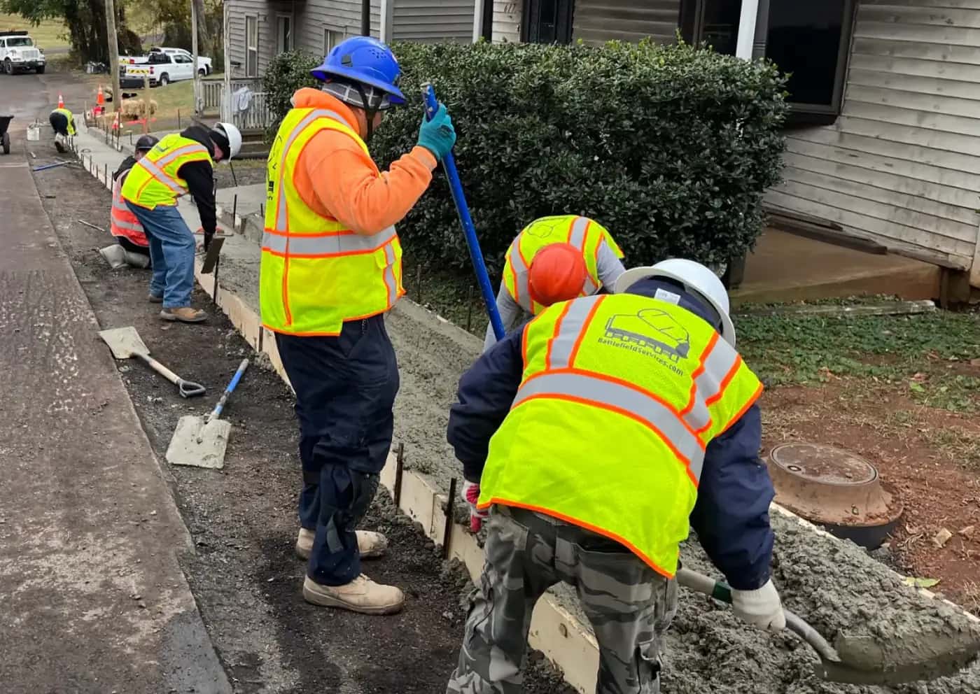 Concrete crew preparing commercial or municipal sidewalk concrete work