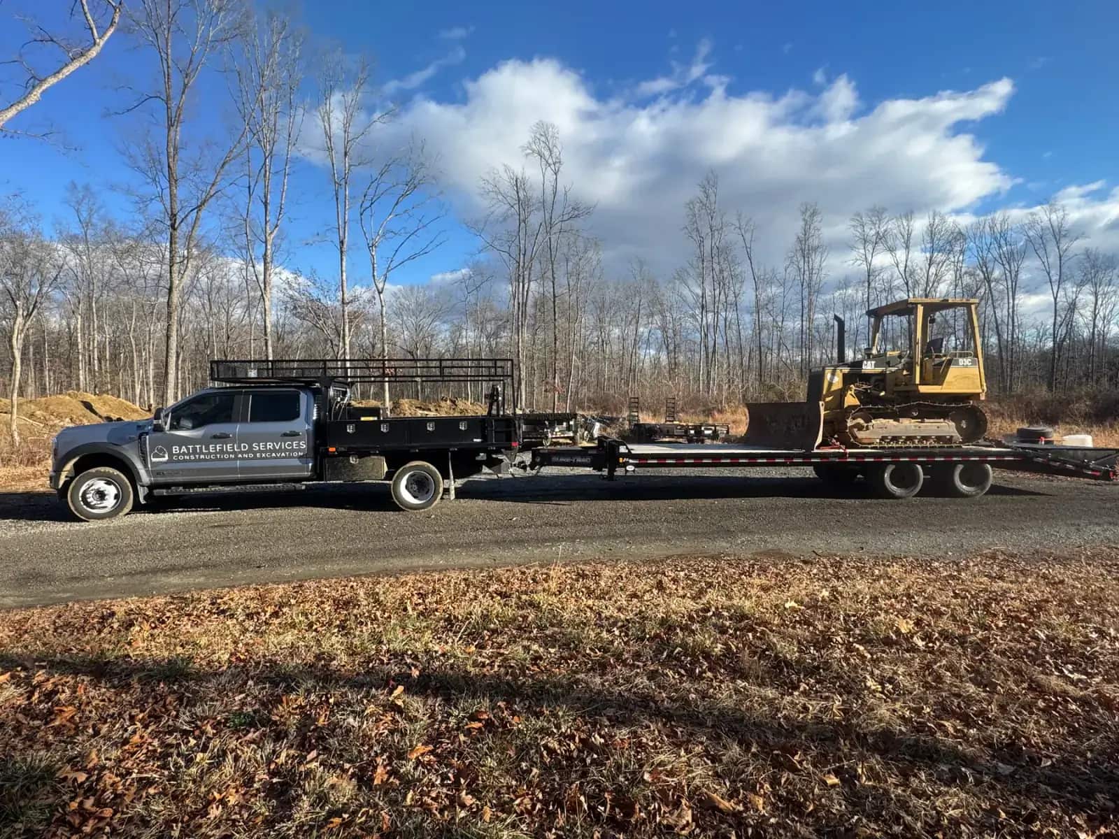 Battlefield Services truck and equipment trailer at a construction project