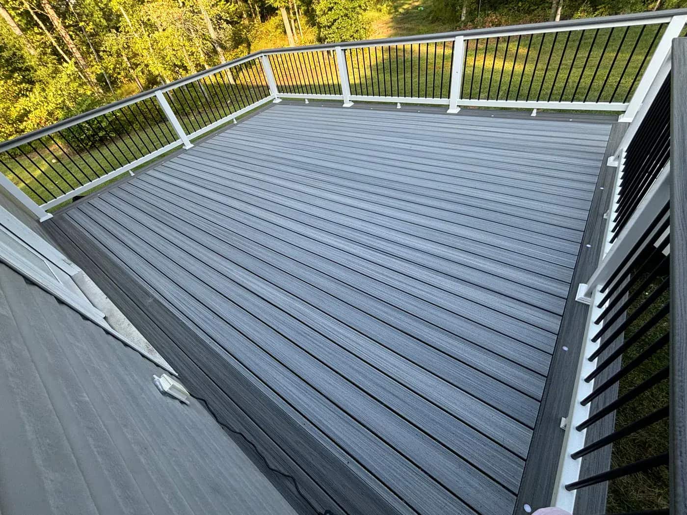 Picture frame composite deck detail with finished border and rail profile