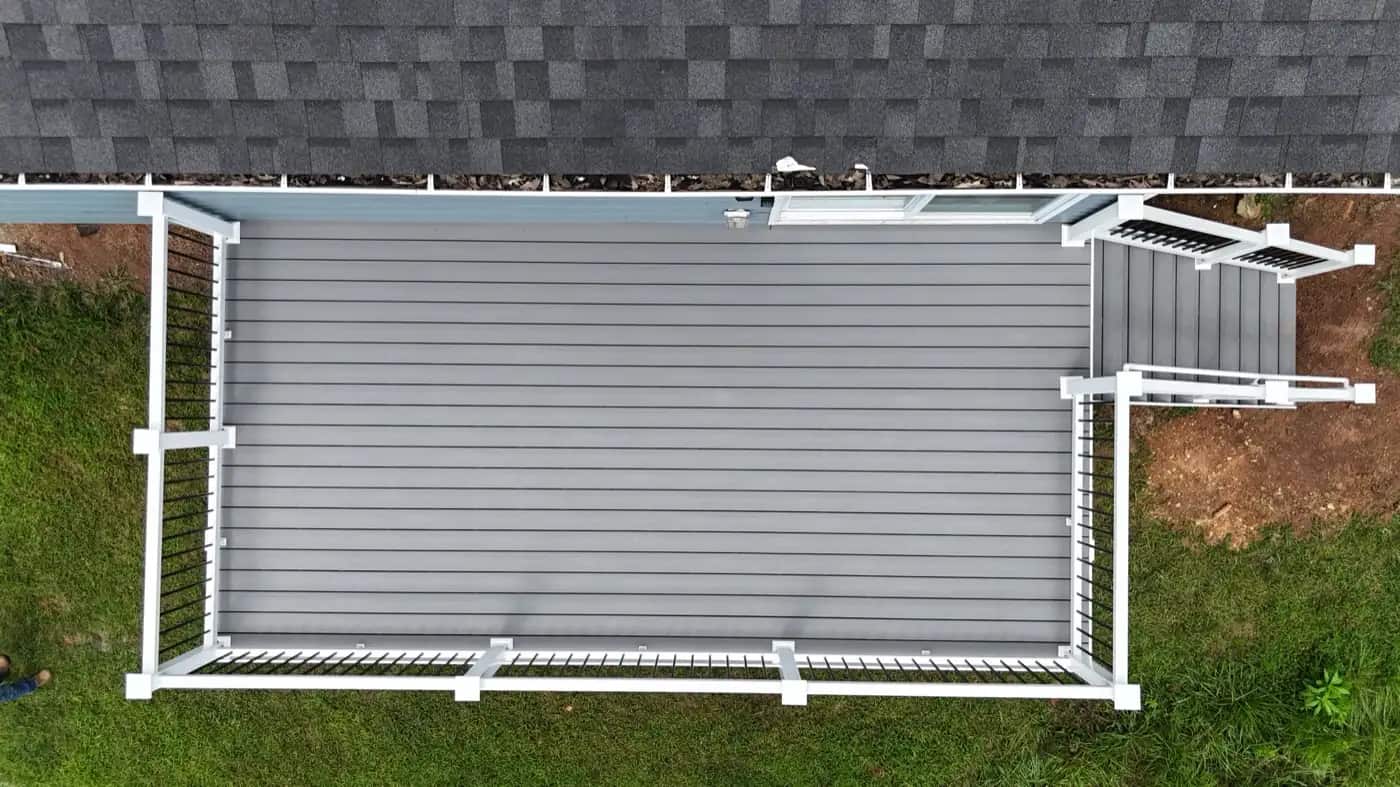 Aerial view of a 10x20 Trex Pebble Beach deck with white railing and black balusters in Culpeper VA
