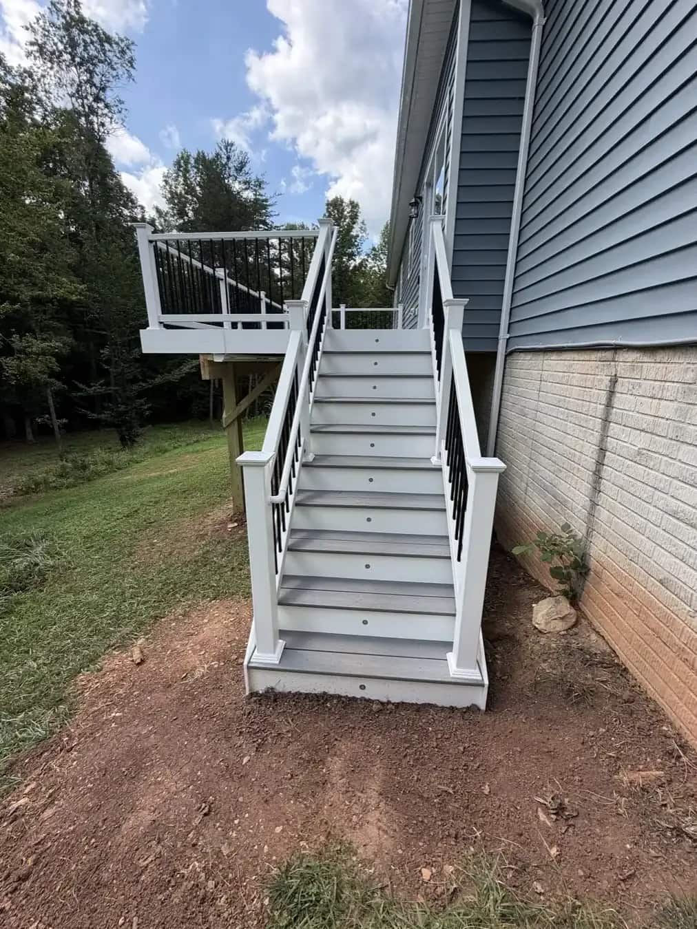 Trex Pebble Beach deck stairs with white railings and black balusters on a Culpeper VA project