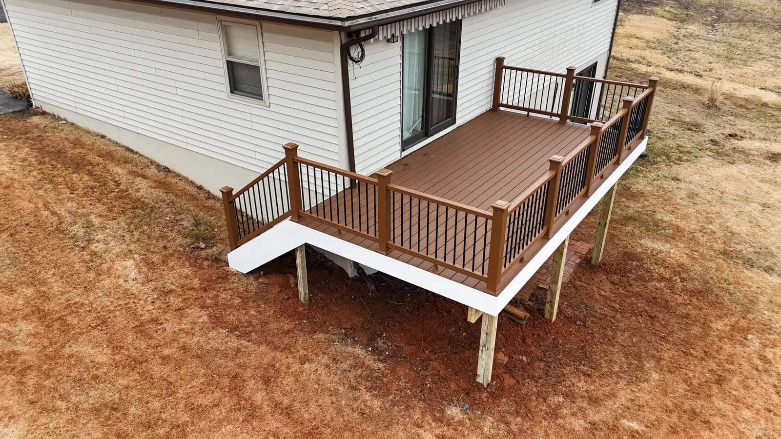Close view of Saddle Brown decking and matching rails