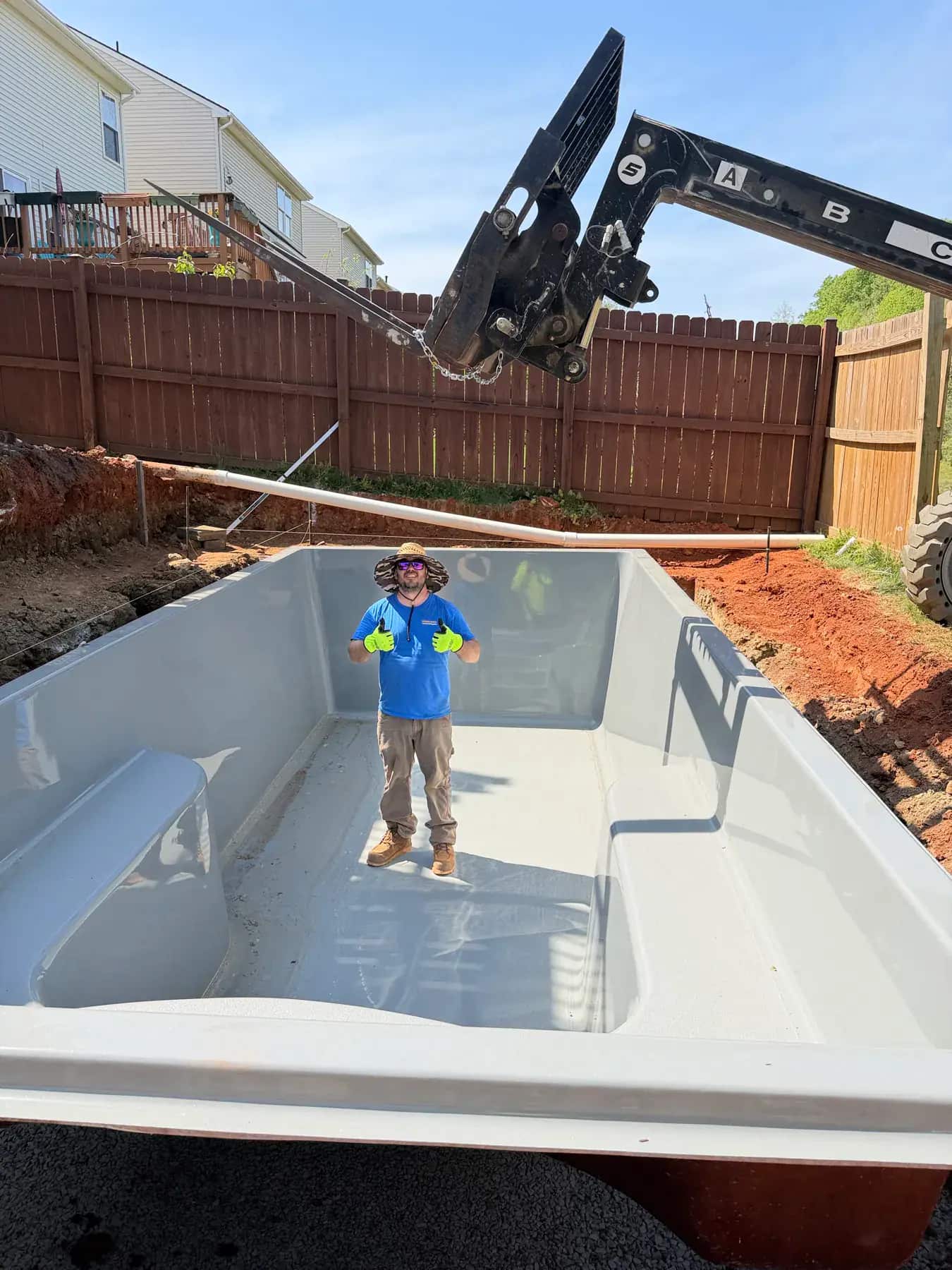 Fiberglass pool project with backyard layout, excavation, shell delivery, and installation planning