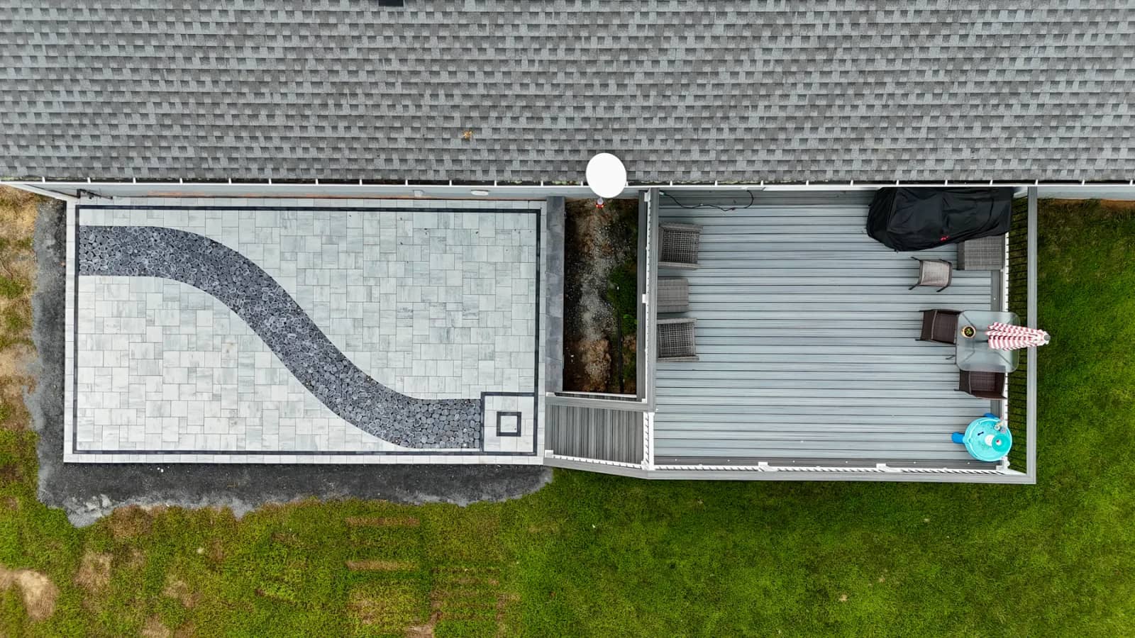 Overhead view showing the patio footprint beside the existing deck and house