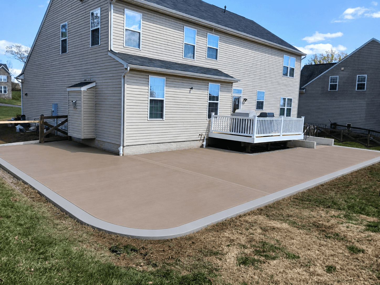 Colored concrete patio with a light gray border