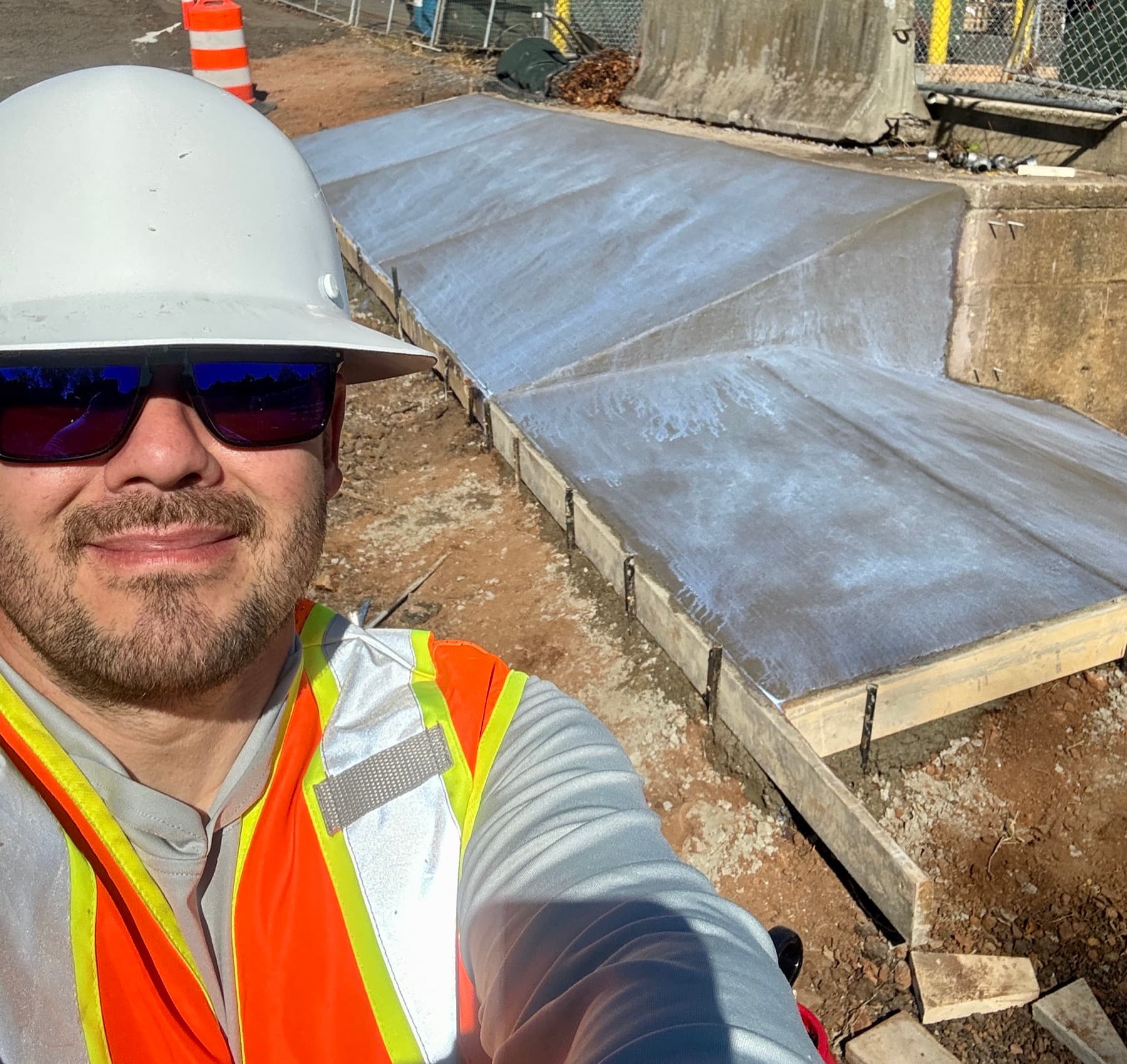 Finished commercial concrete pad with smooth surface and formed edges