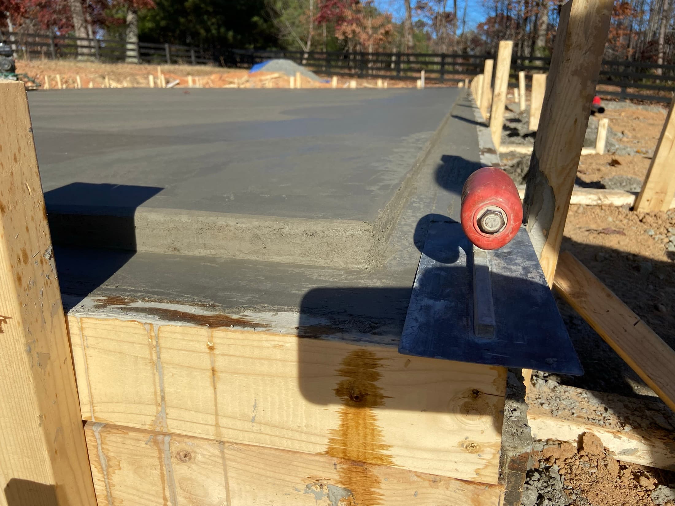 Monolithic foundation edge detail showing notched lip and concrete prep