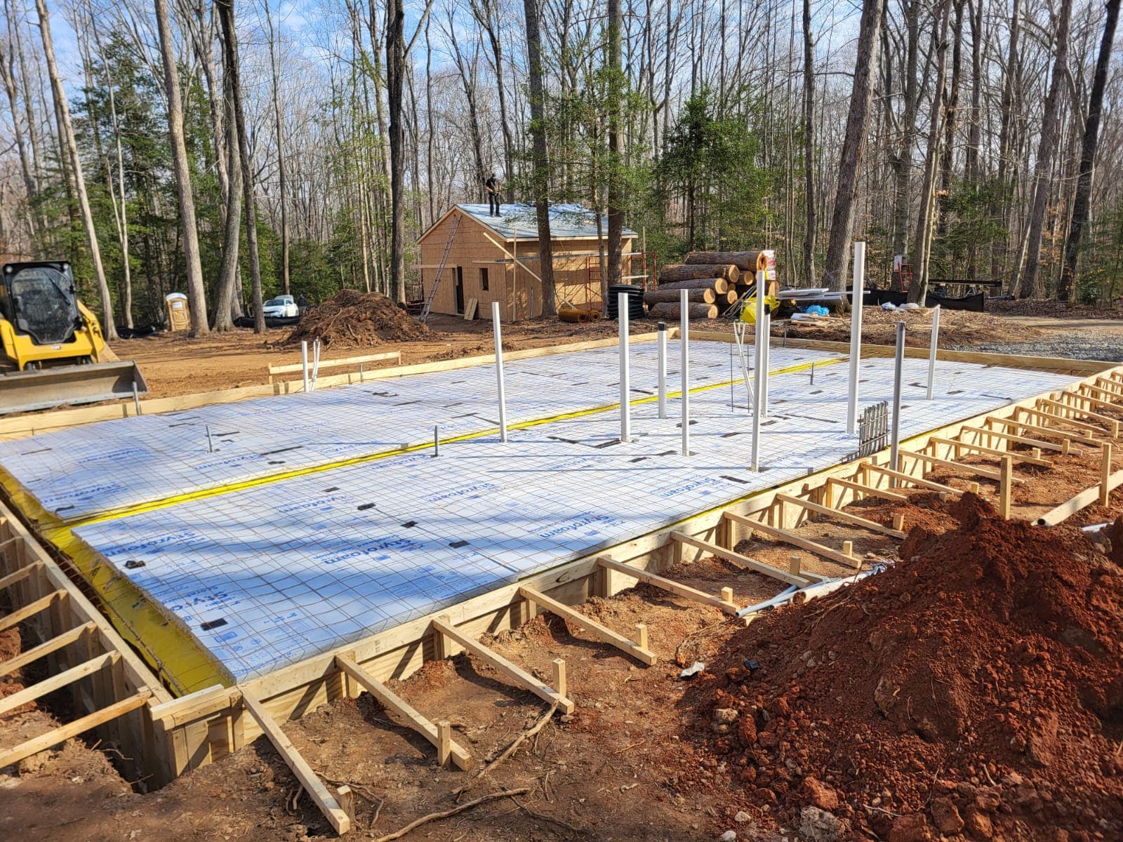 Monolithic foundation slab preparation with layout and site setup
