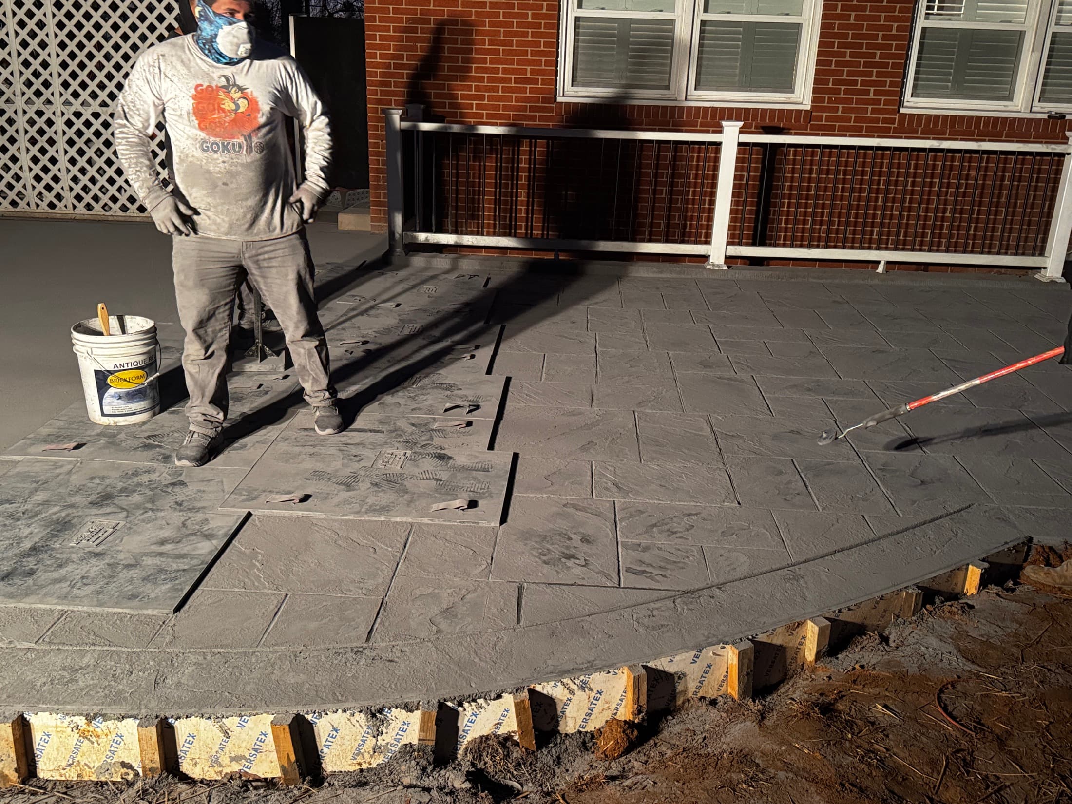 Stamped concrete pattern installation in progress