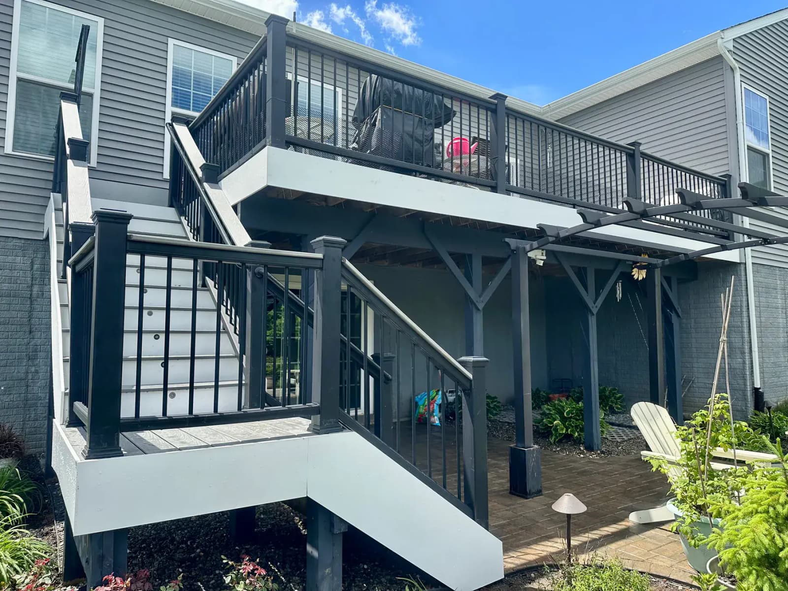 Elevated custom deck with stairs and dry space below