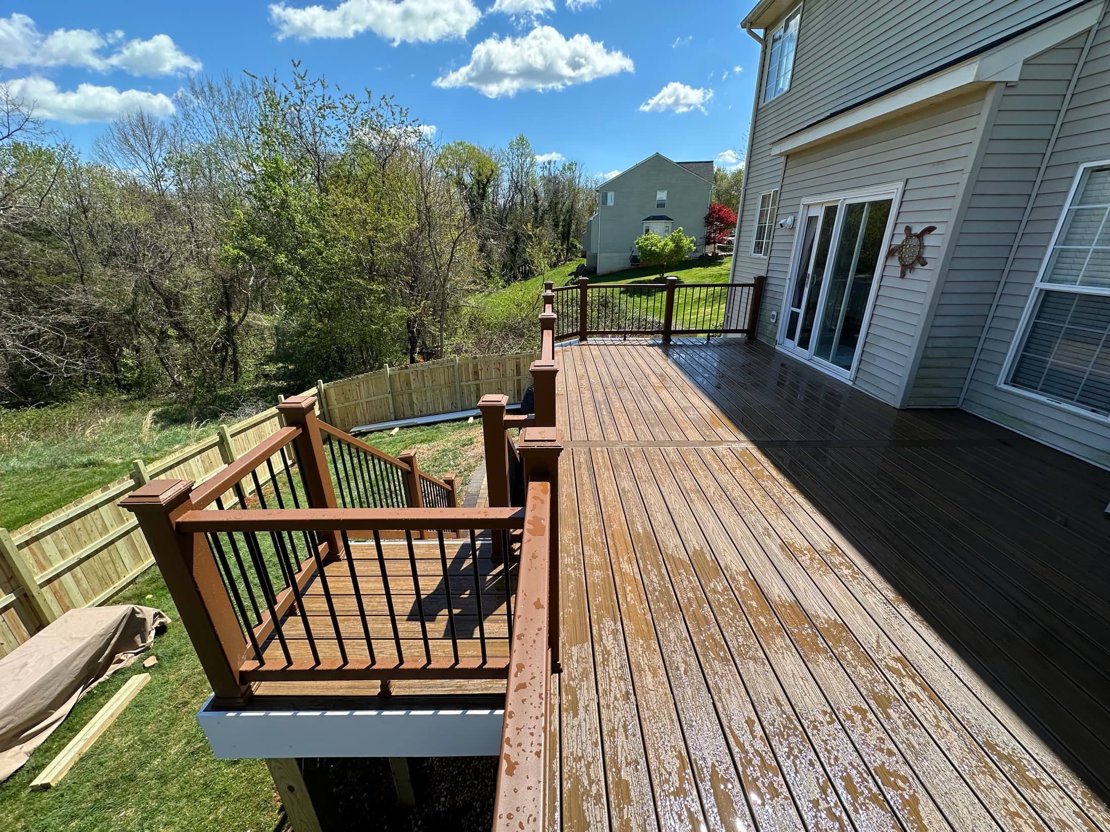Finished elevated deck side view showing structure and stairs