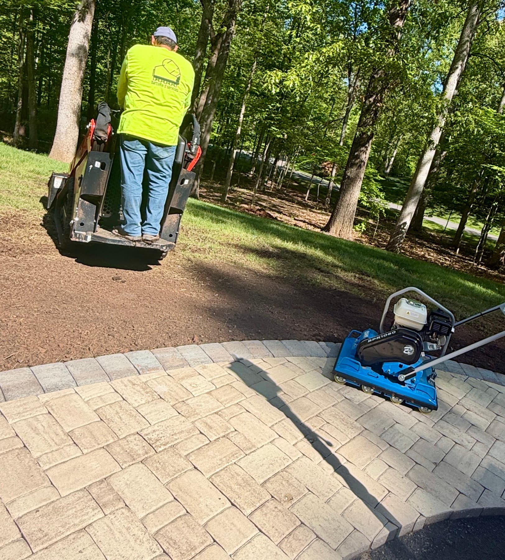 Compactor used during paver patio installation