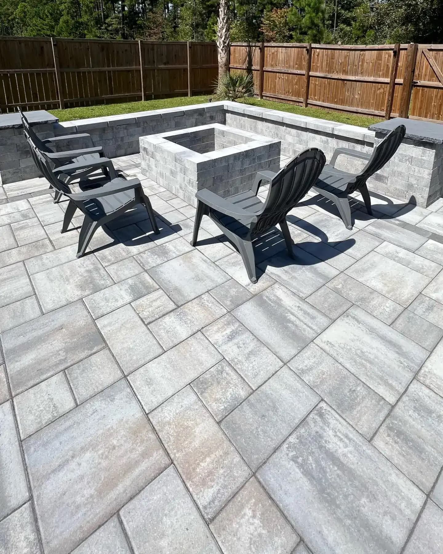 Finished paver patio with fire pit seating area