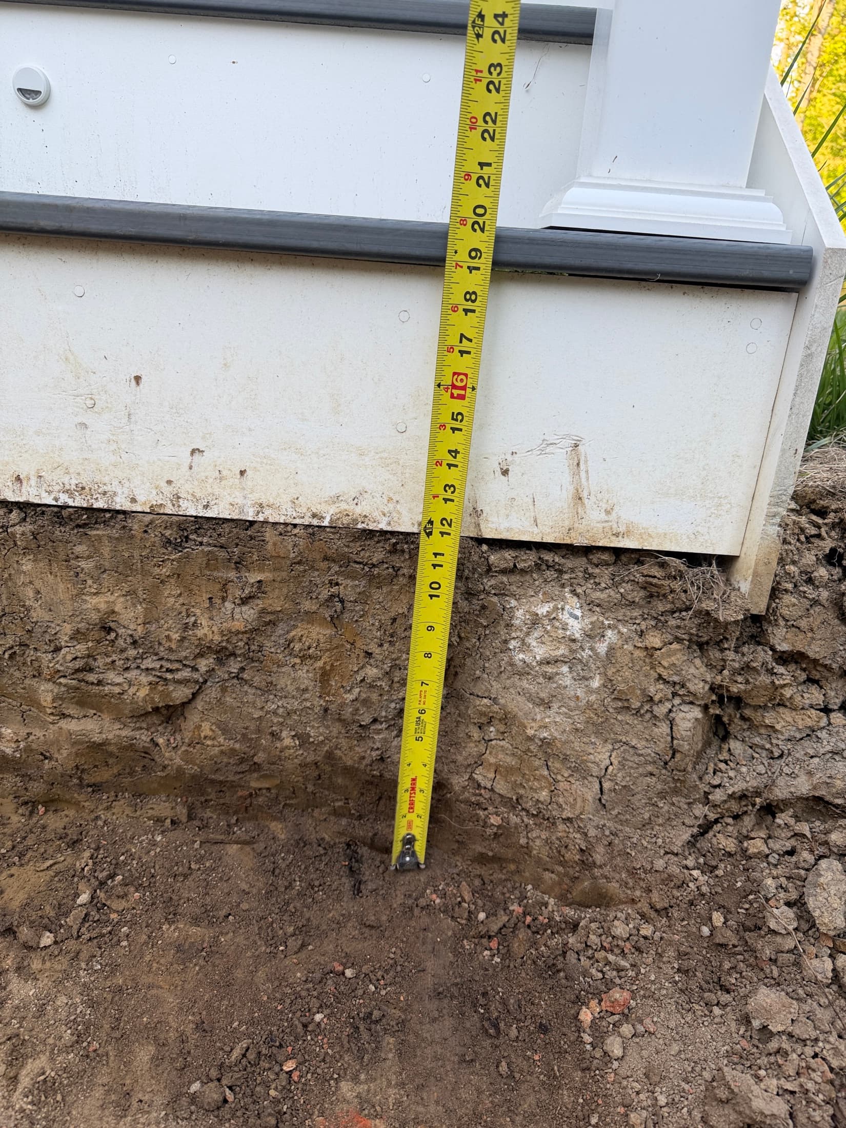 Paver patio base depth check before hardscape installation