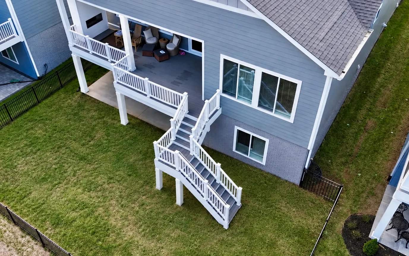 Aerial view of Battlefield's 20x4 deck extension, stairs and mid-landing connecting an existing deck to the yard in Culpeper