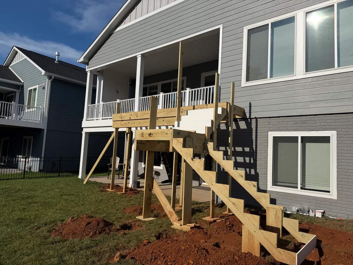 During construction: framing for the deck bump-out, new stairs and mid-landing