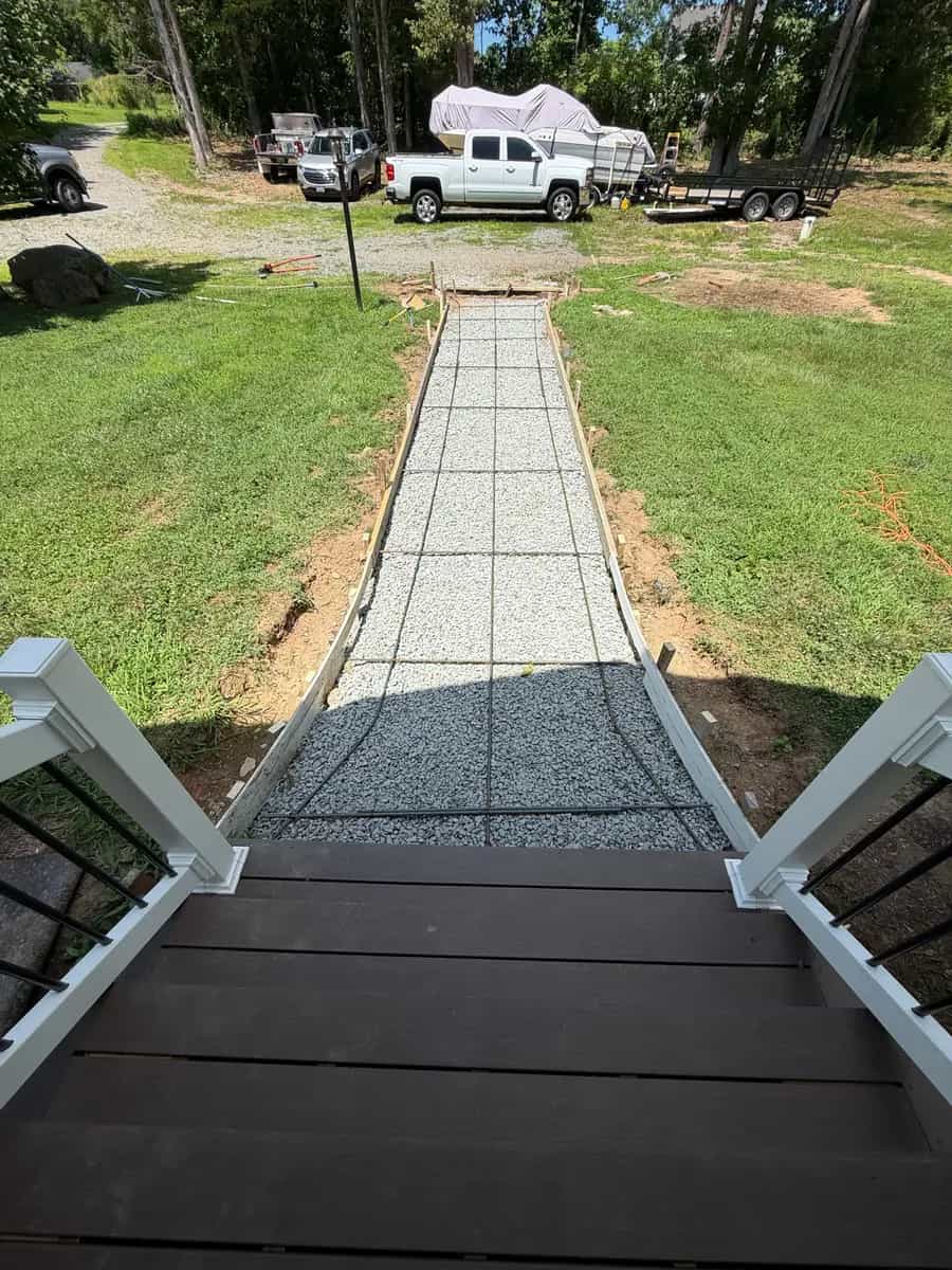 Stone base preparation for a stamped concrete front walkway viewed from the porch