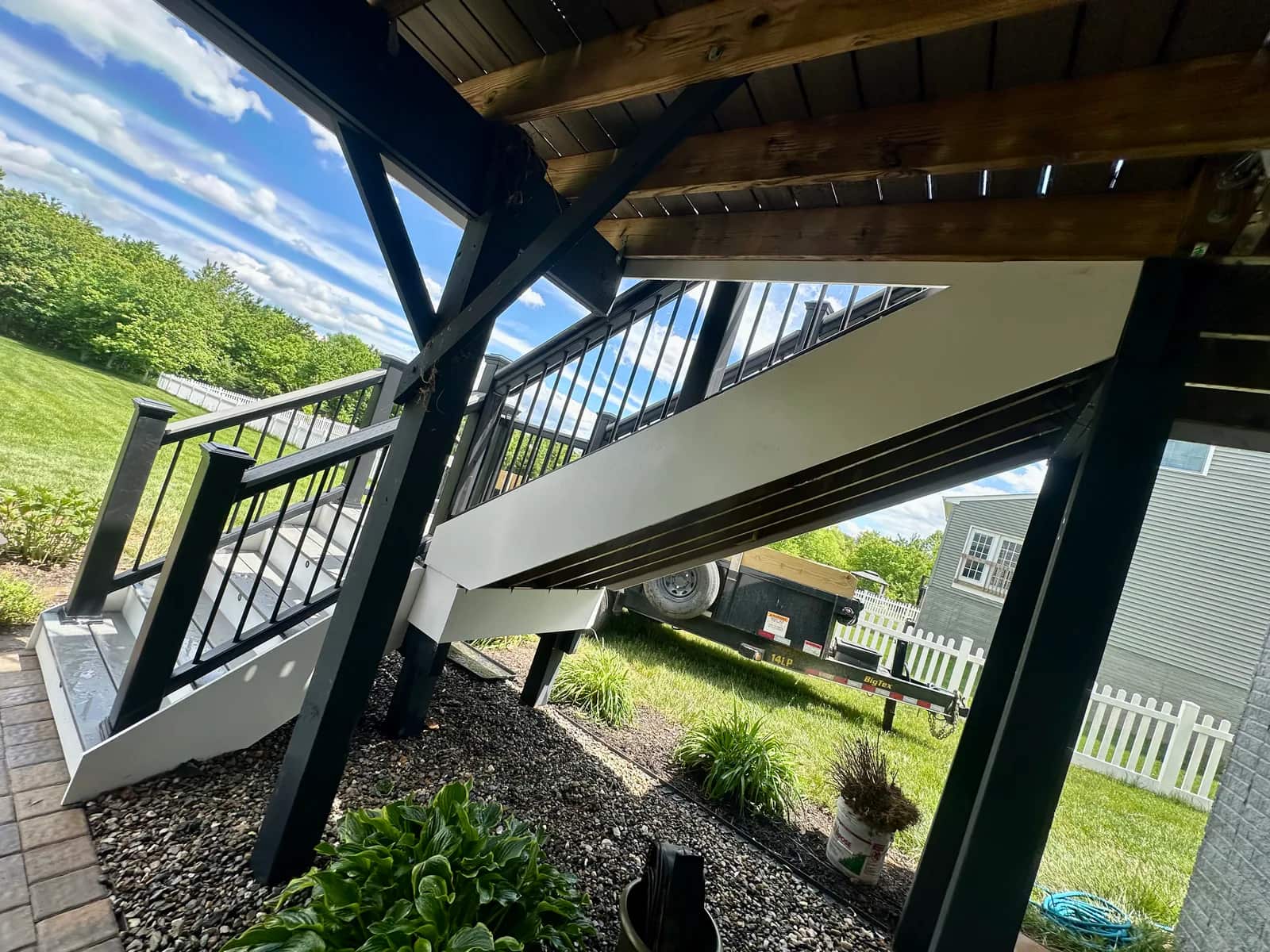 Elevated Orange VA deck resurfaced with composite boards while retaining the existing railing system