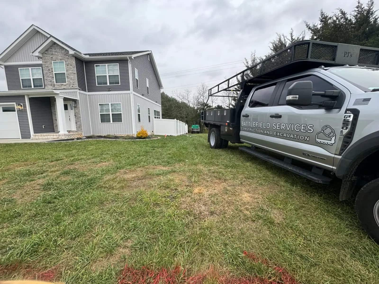 Battlefield Services truck at a fence project in Culpeper
